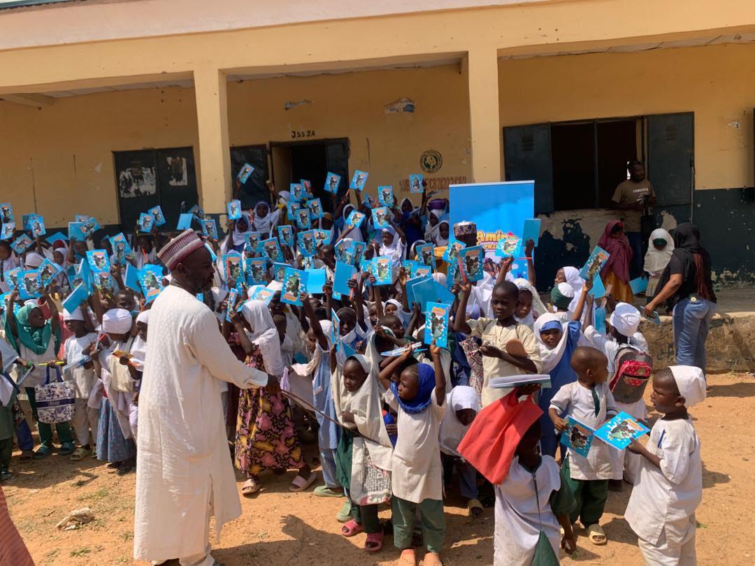Distributing books to children