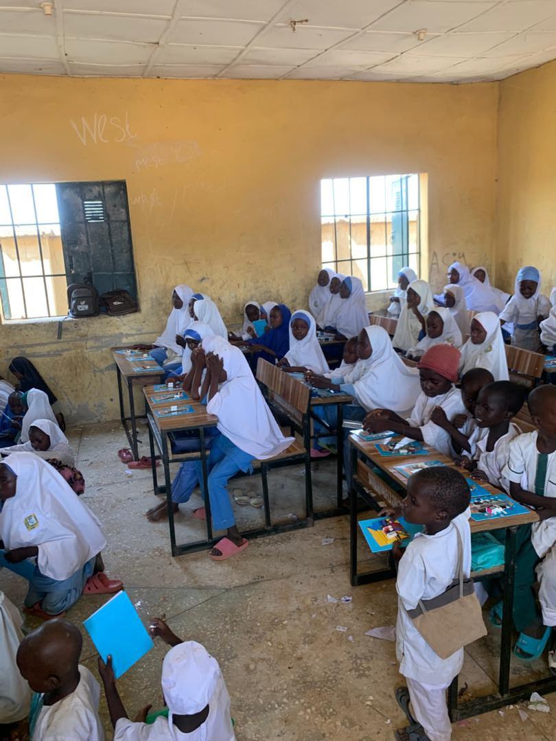 Children reading Amira books at their desks